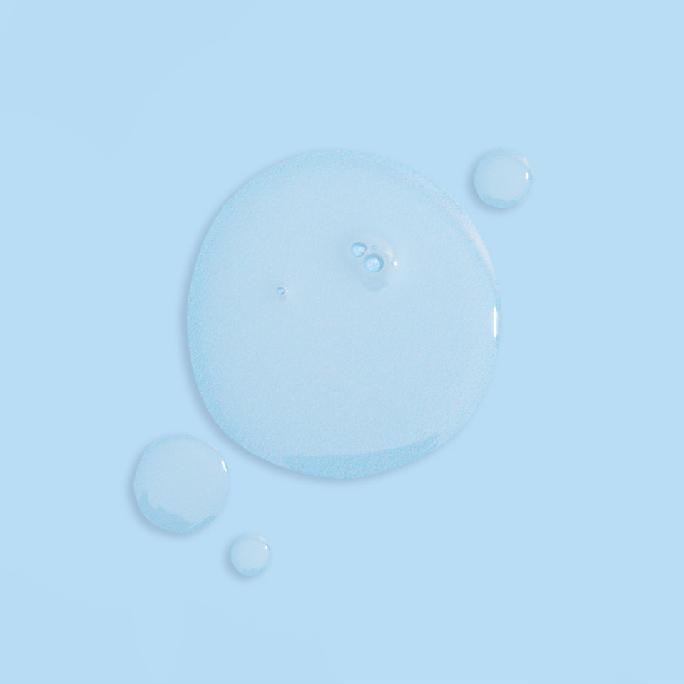 Close-up of water droplets on a light blue background