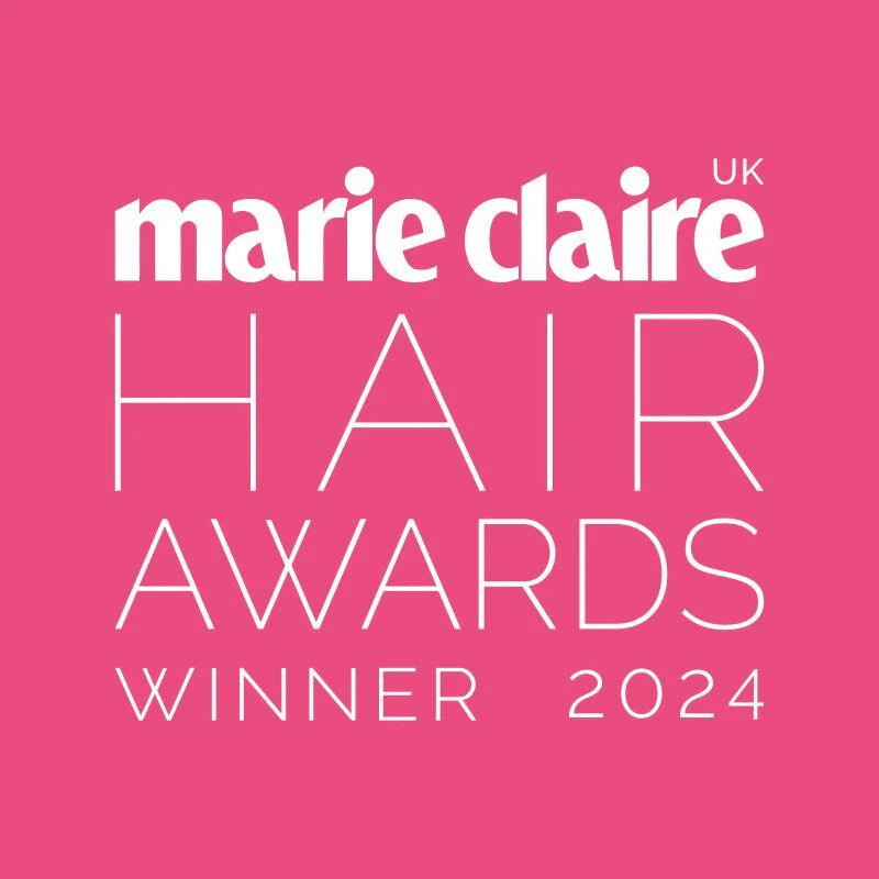 Marie Claire UK Hair Awards Winner 2024 text on a pink background