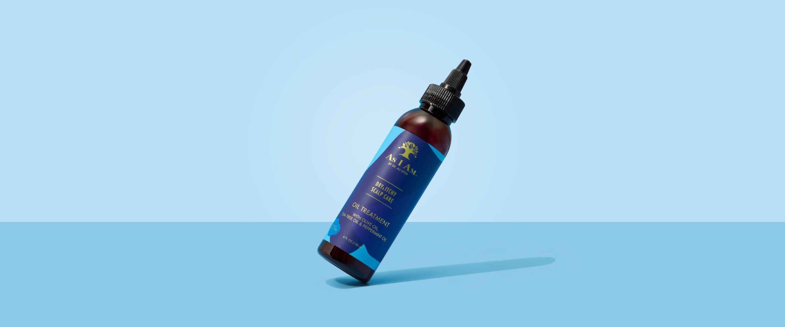 Bottle with blue label on a light blue background