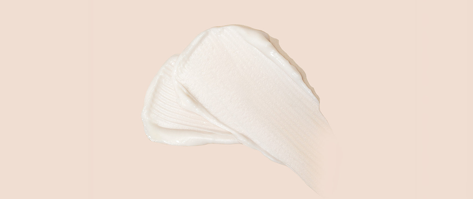 White cream swatch on a beige background